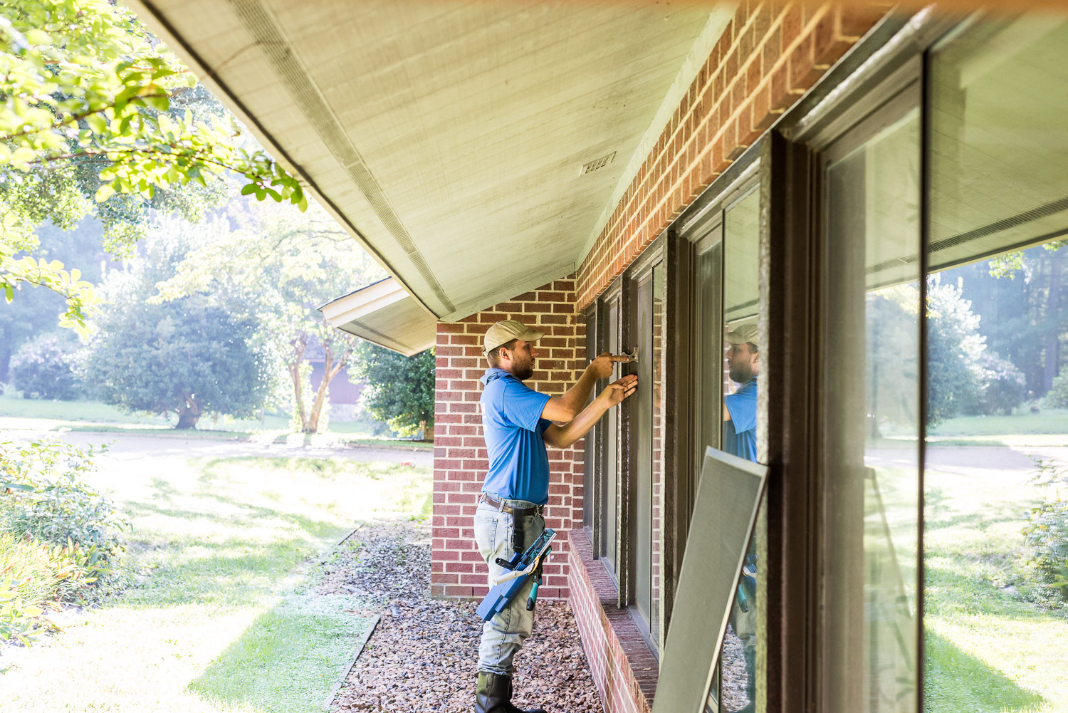 Our crew adding a screen to a window in Richmond, VA.